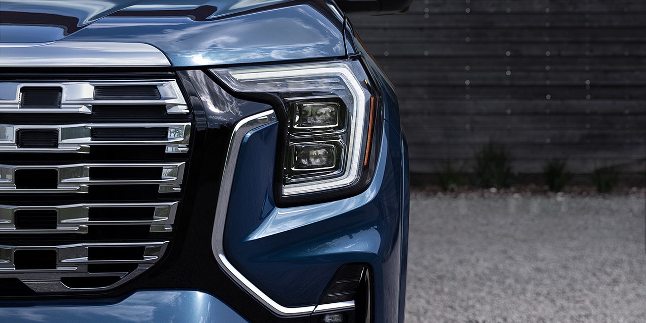 Close-up of the Illuminated Designed Headlamp on the 2026 GMC Terrain Denali Luxury SUV