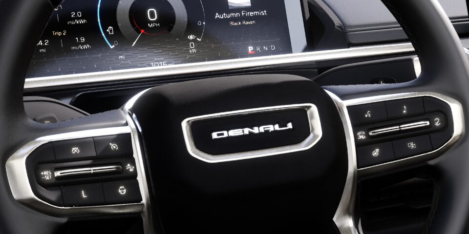 Close up interior shot of the Sierra vehicle focusing on steering wheel
