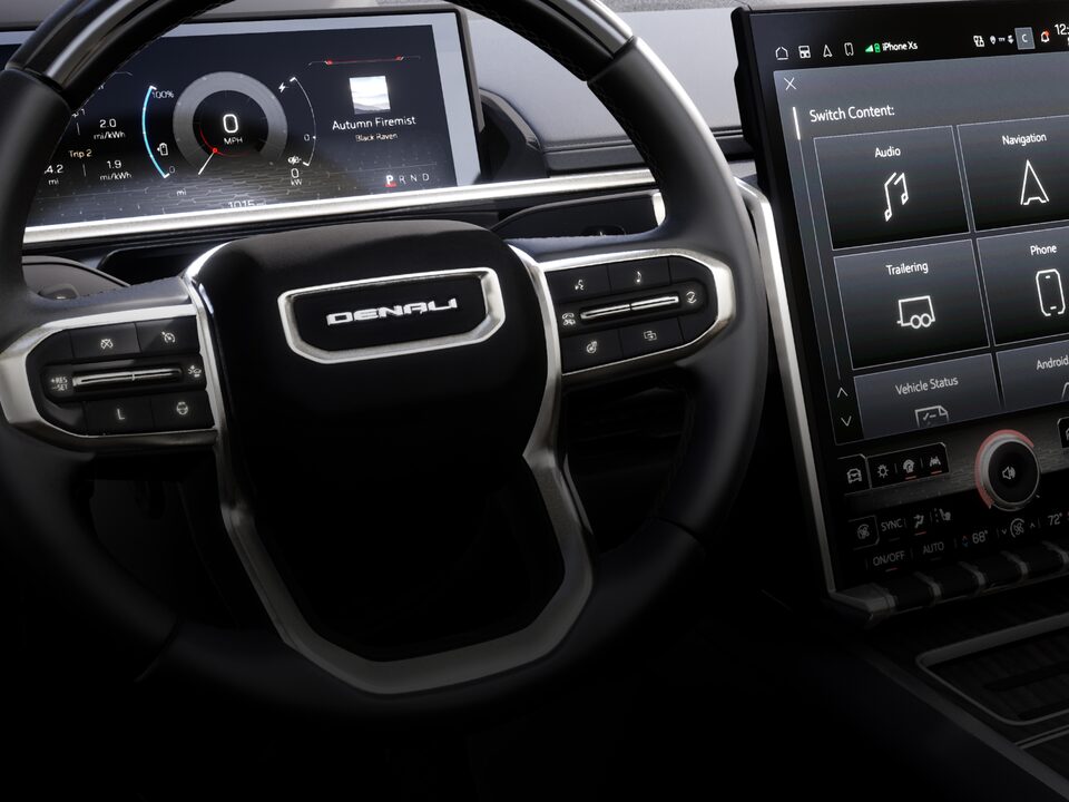 Close up interior shot of the Sierra vehicle focusing on steering wheel