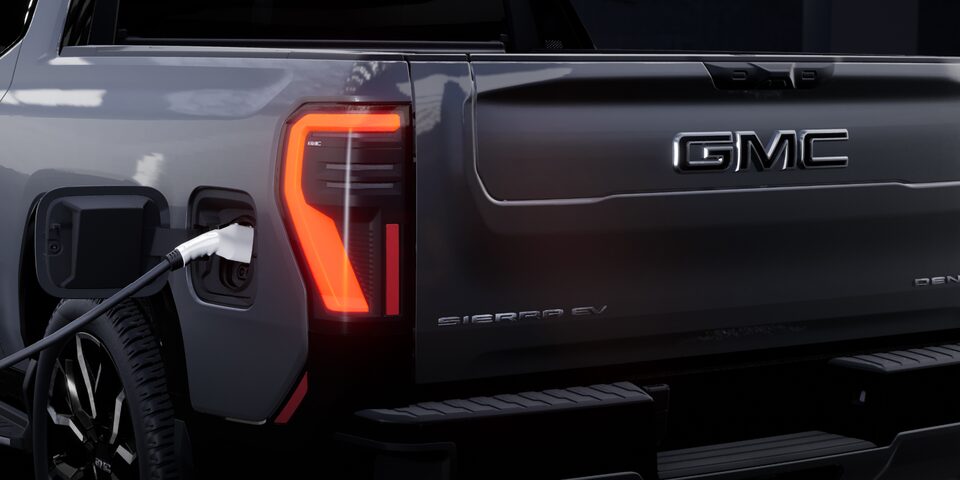 Close up shot of Sierra EV vehicle tailight with GMC logo in focus