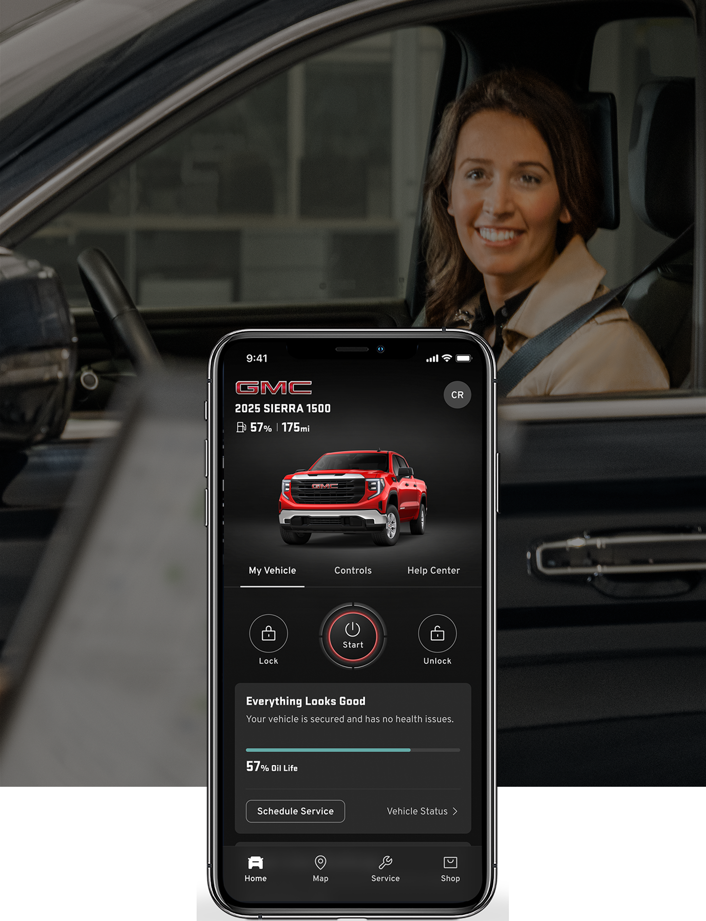 A Woman in a Vehicle with a Phone Displayed on Top of the Image with the myGMC Mobile App.