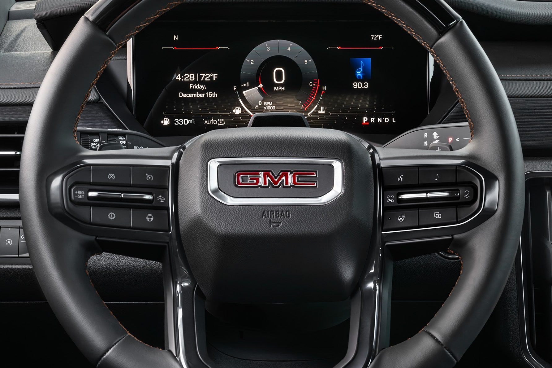 A Front View of the Steering Wheel and Dashboard of a GMC Vehicle.