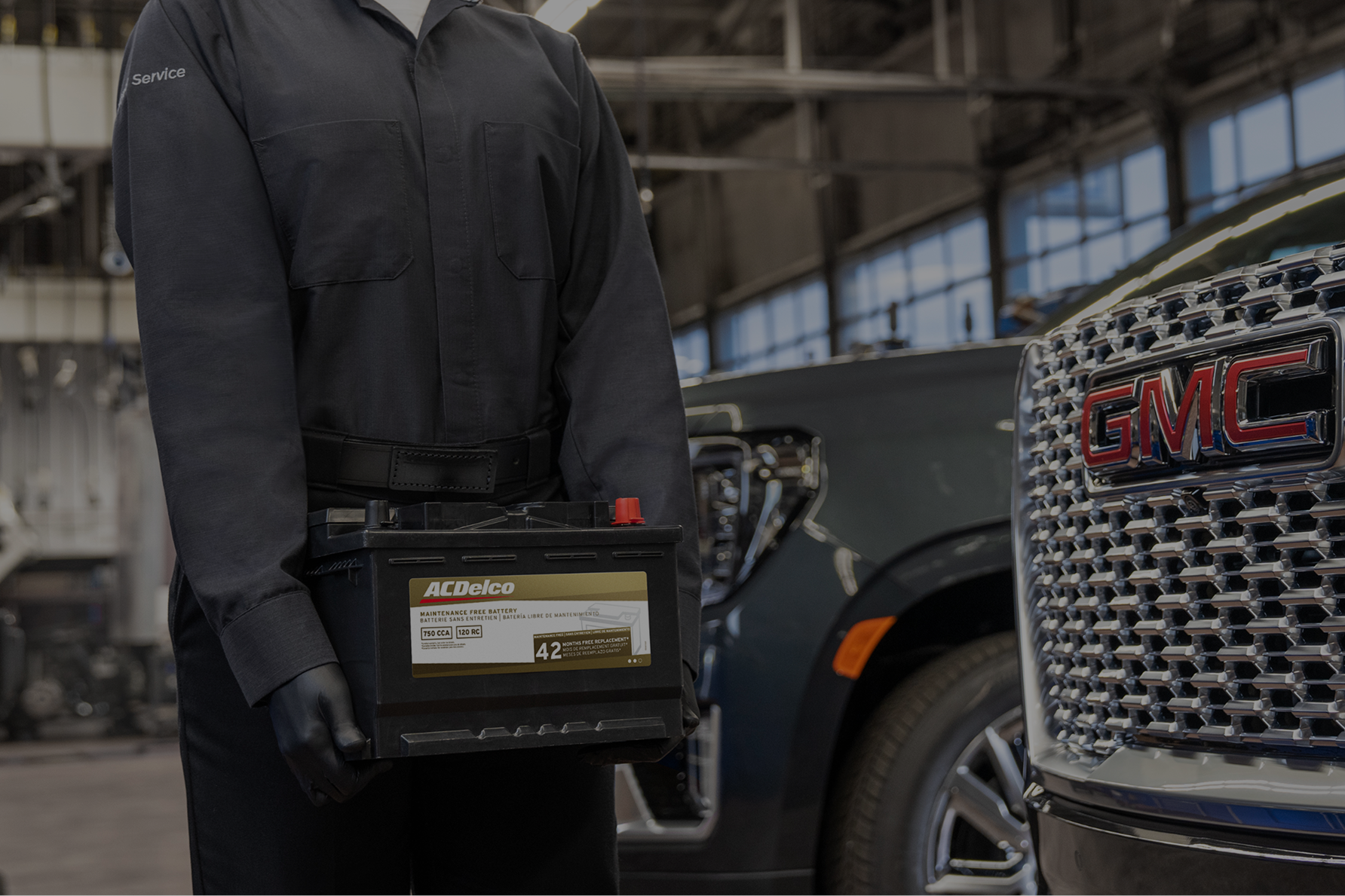 A Technician Working on a Car Battery.