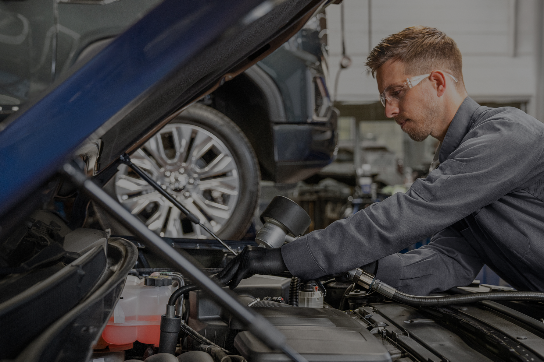 A Technician Working on a Transmission of a Vehicle.