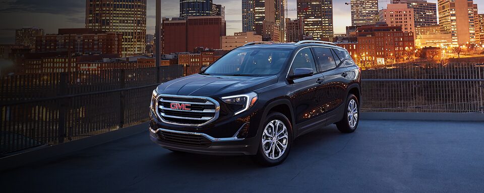 2021 GMC Terrain SLT Elevation Edition Small SUV parked with headlights on