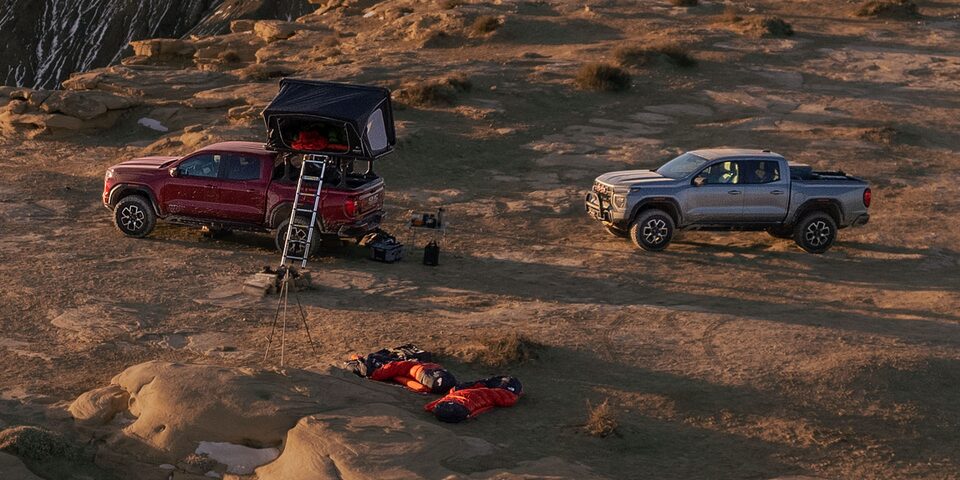An Aerial Shot of Two GMC Vehicles Parked Off-Road