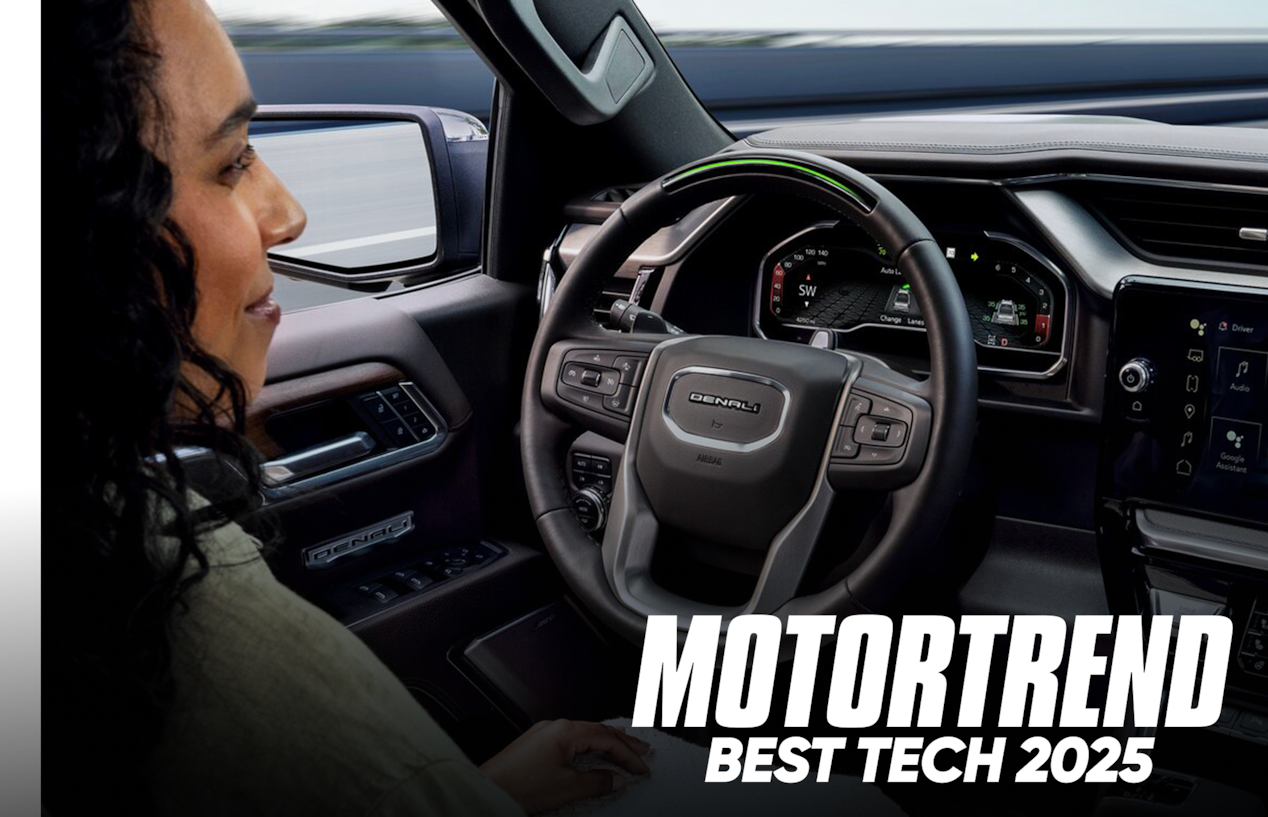 Over the Shoulder View of a Woman Using Super Cruise Hands-Free Technology in Her GMC with Text Overlay: MOTORTREND BEST TECH 2025