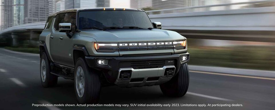 GMC HUMMER EV Electric SUV Driving on City Road
