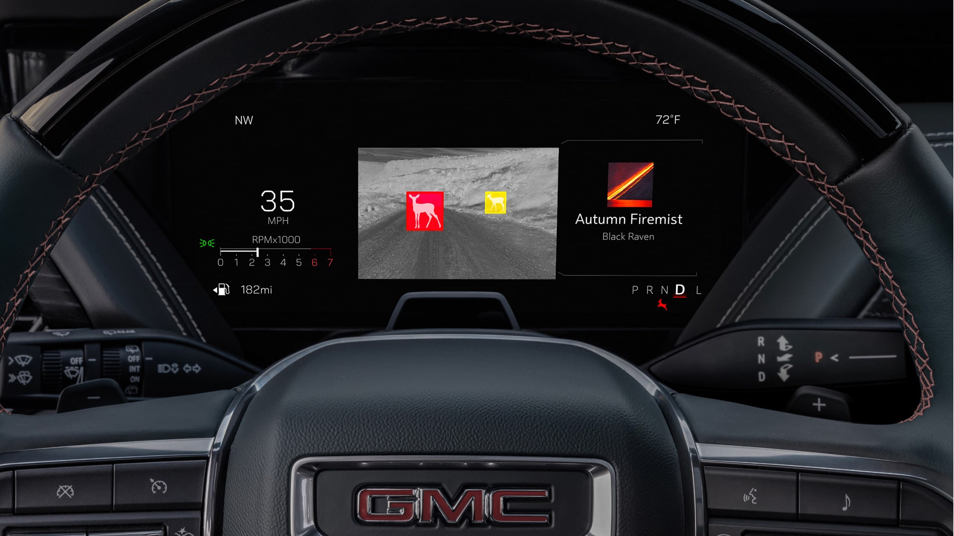 Close-up of the GMC Yukon Steering Wheel and the Driver Information Center Displaying the Available Night Vision Feature