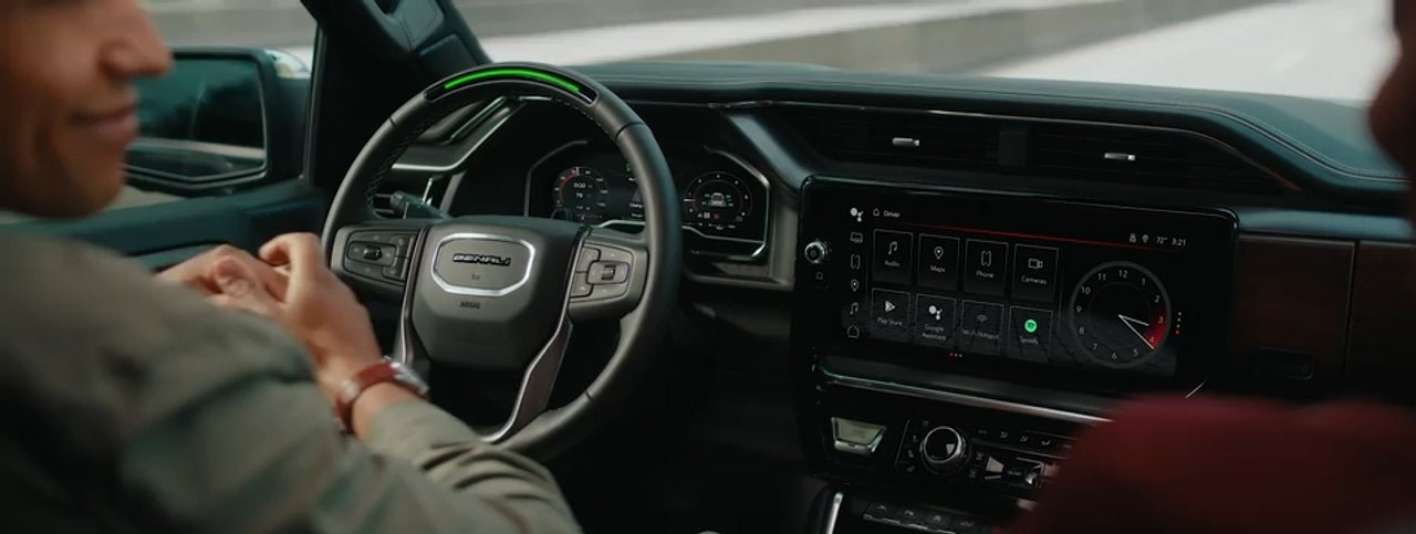 A Driver Enjoys Hands Free Convenience with GMC Super Cruise on a Scenic Road