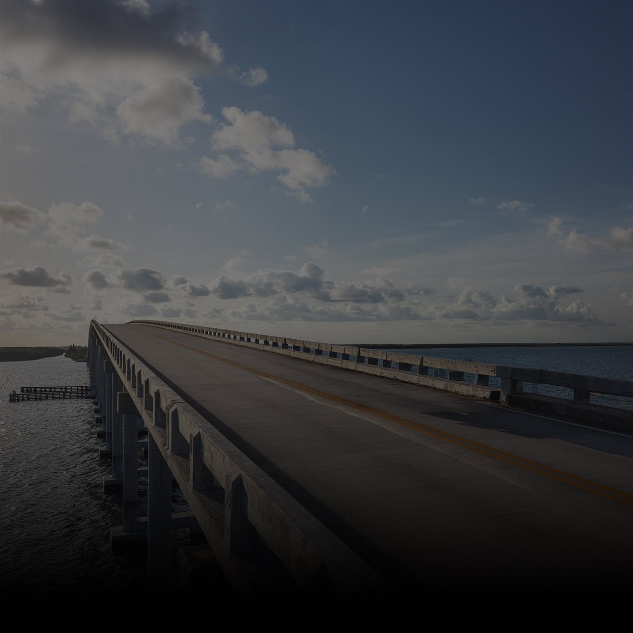 A Long Bridge Stretches Over a Body of Water