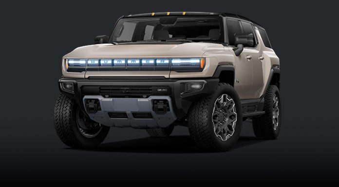 Front Three Quarter View of a Light Tan GMC Hummer EV SUV