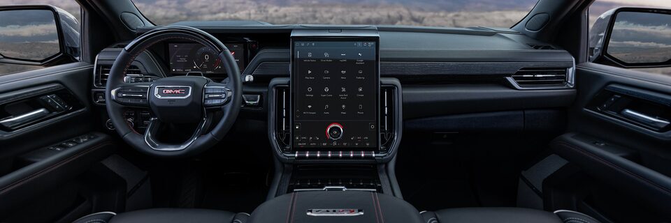 Interior View of the GMC Yukon Steering Wheel and Infotainment System