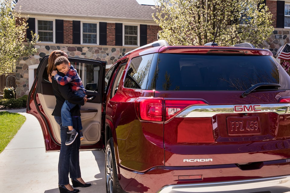 GMC life acadia rear seat reminder mom with son.