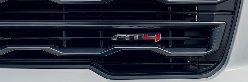 Close-up of the AT4 Badging on the Acadia Mid-Size SUV Grille