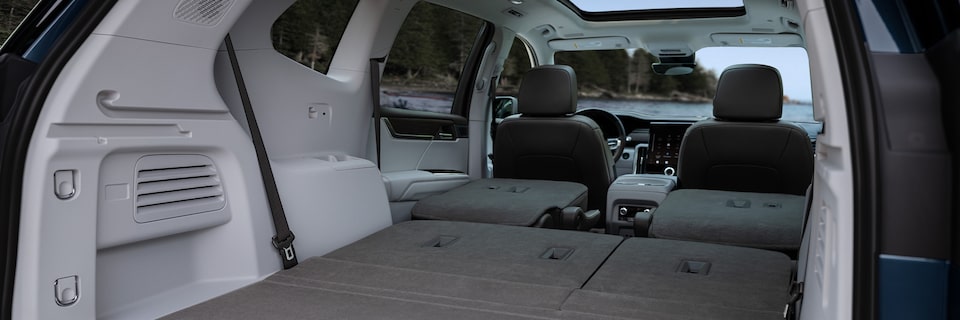 Interior View From the Open Tailgate Displaying the Rear Seats Folded Down in the GMC Acadia