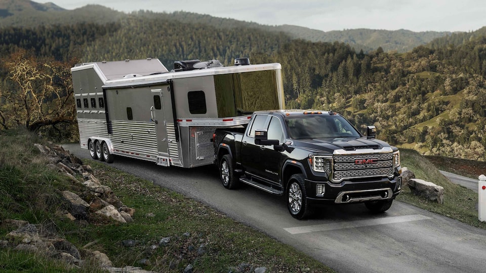 2022 GMC Sierra Towing a Trailer on Mountainous Road