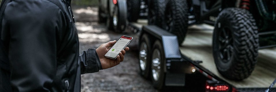 Close-up of a Man Using the MyGMC Mobile App