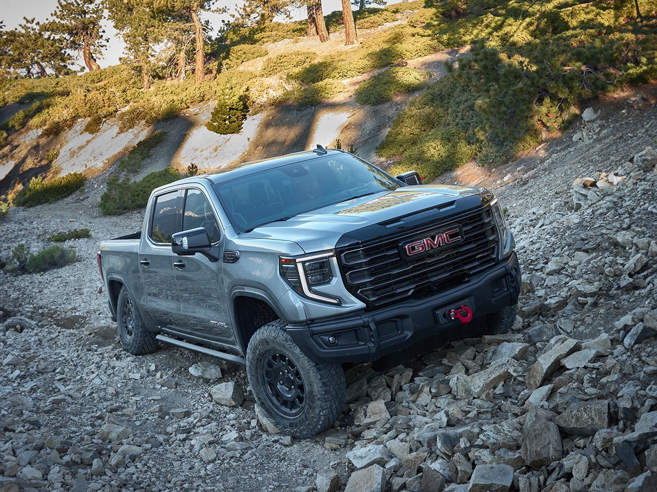 A GMC AT4X AEV Edition Truck Driving Off-Road