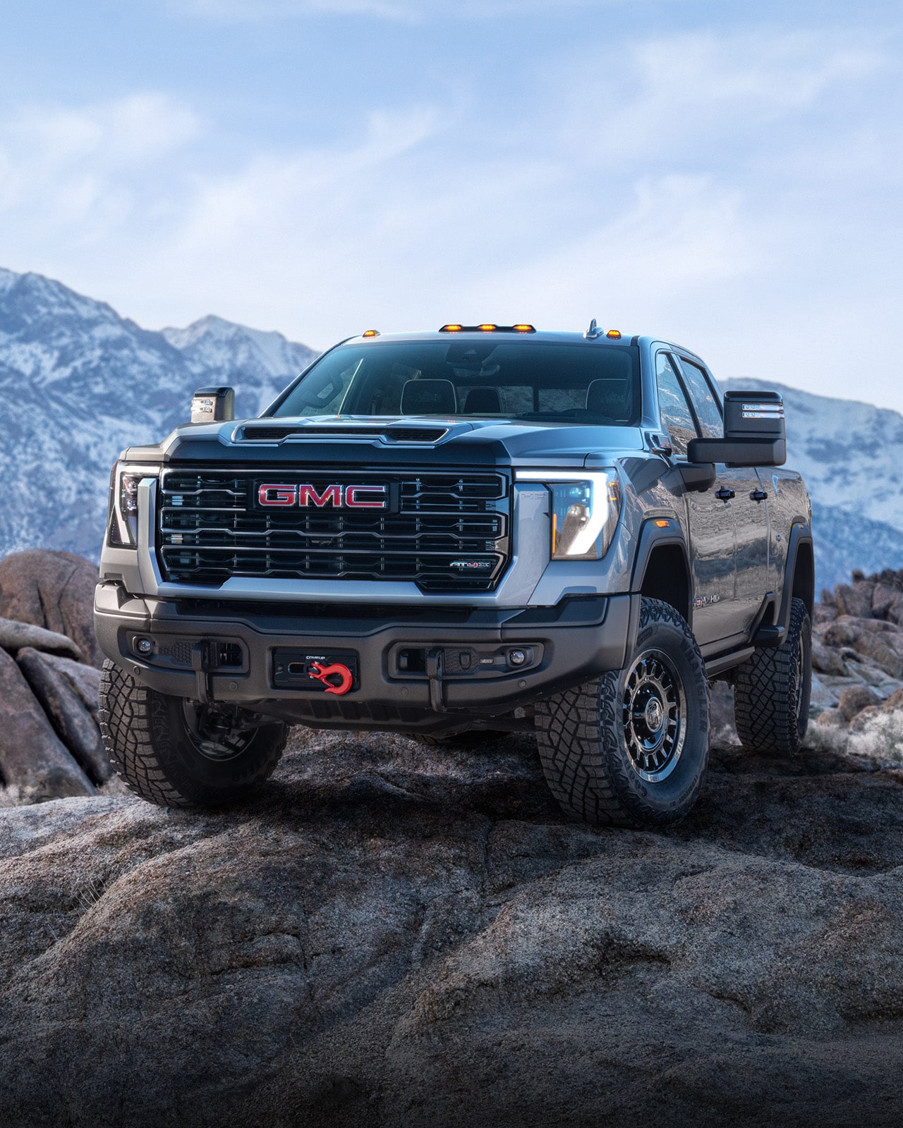 A GMC AT4X AEV Edition Truck Parked on a Mountain Top