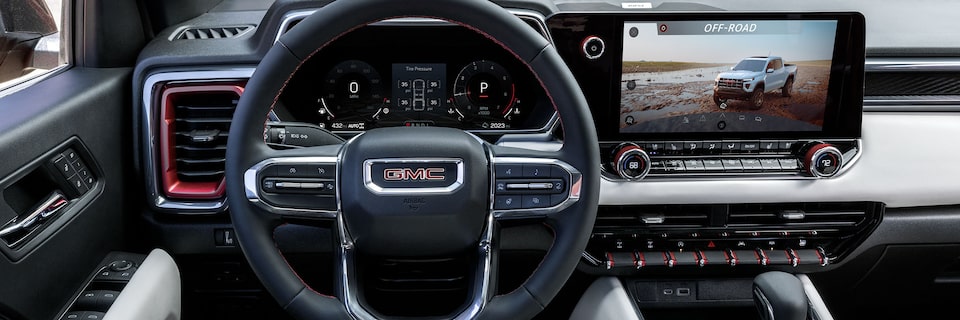 Drivers Side View of the Interior Dashboard and Steering Wheel of the GMC Canyon AT4X