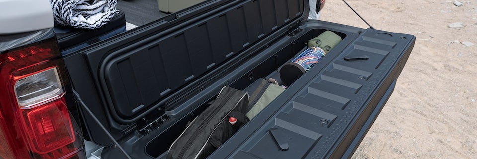 The GMC Canyon AT4X MultiStow Tailgate Filled with Fishing Gear