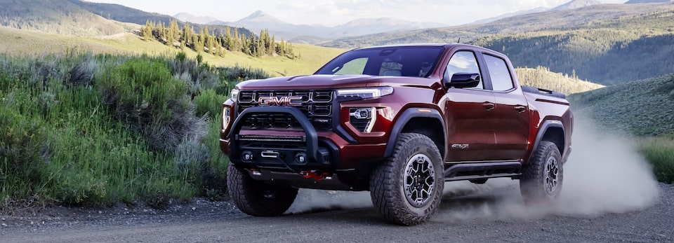 The Powerful New GMC Canyon AT4X Driving Off-Road Kicking Up Dirt in the hills