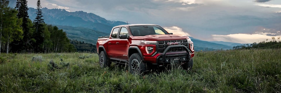 The GMC Canyon AT4X Off-Road Pickup Truck Parked in a Green Valley