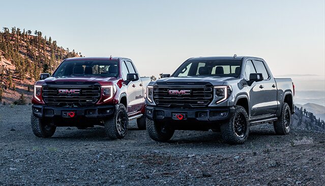 The GMC Sierra AT4X & The Canyon AT4X Displayed Fiercely on a Mountain Edge 