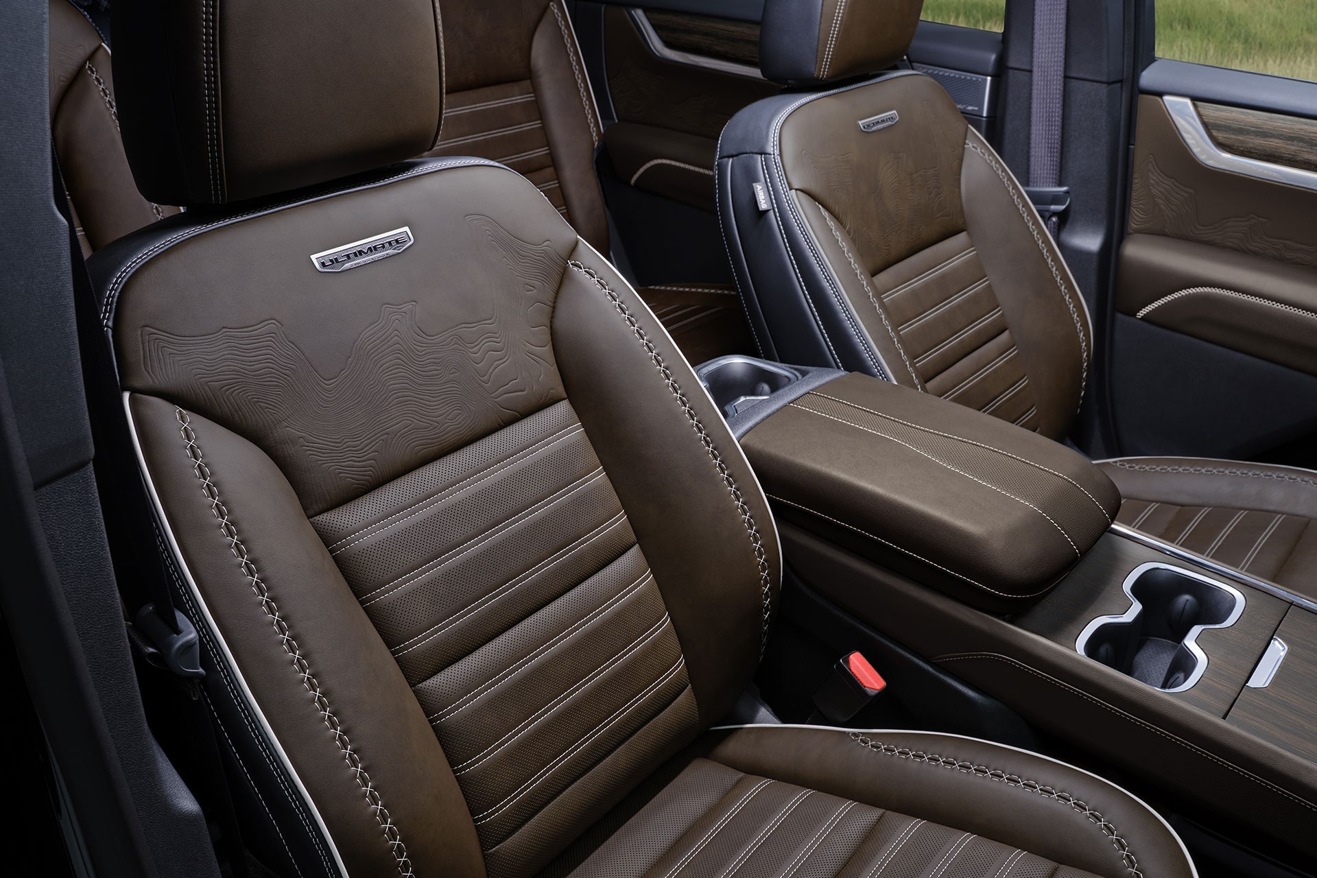 A Close-Up of the Luxurious Brown Leather Seats and Center Console in a GMC Denali Vehicle