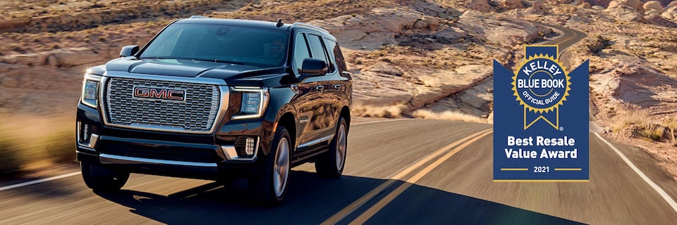 2021 GMC Yukon Denali Luxury SUV on road | KBB Official Guide Best Buy Award