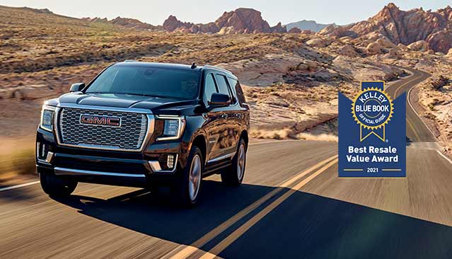 2021 GMC Yukon Denali Luxury SUV on road | KBB Official Guide Best Buy Award