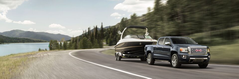 GMC Canyon Denali Tows Boat Exterior Wide Angle