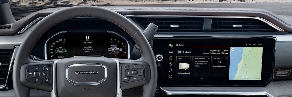 Front View of a Grey Steering Wheel and the Vehicles Interior Dashboard