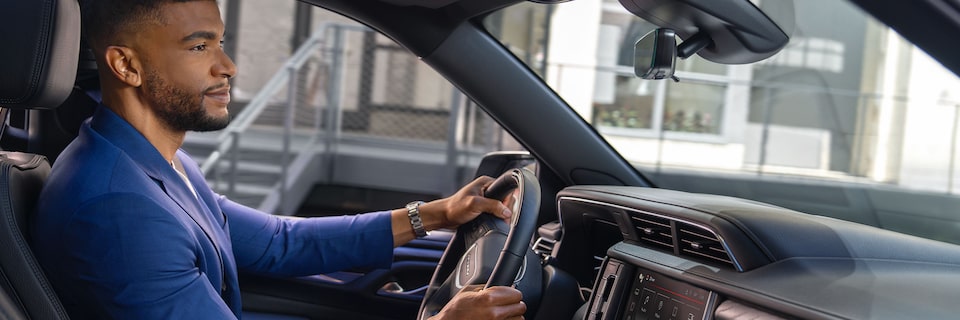Profile View of a Man Driving in his GMC Vehicle