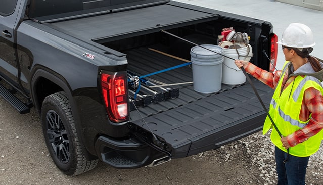 SHIELD YOUR CARGO WITH A TONNEAU COVER FROM GMC ACCESSORIES