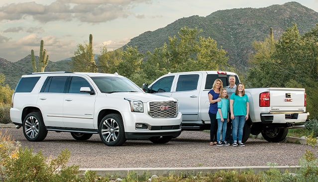 GMC Sierra HD 2500 Denali and GMC Yukon Denali with Family