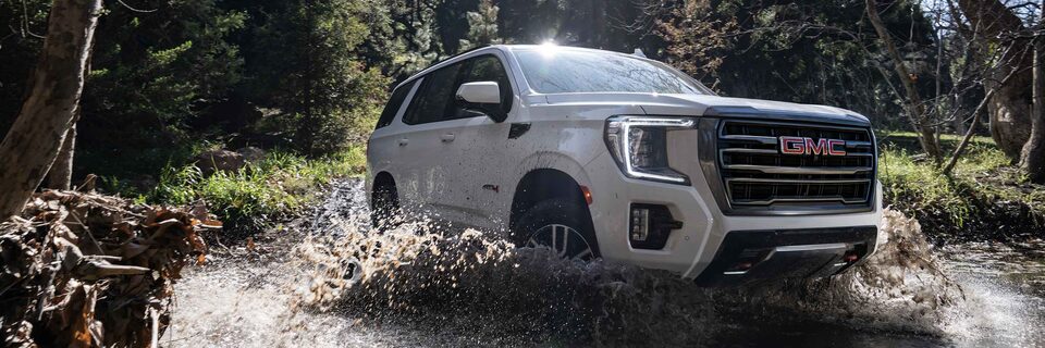 2022 GMC Yukon AT4 SUV Driving in River
