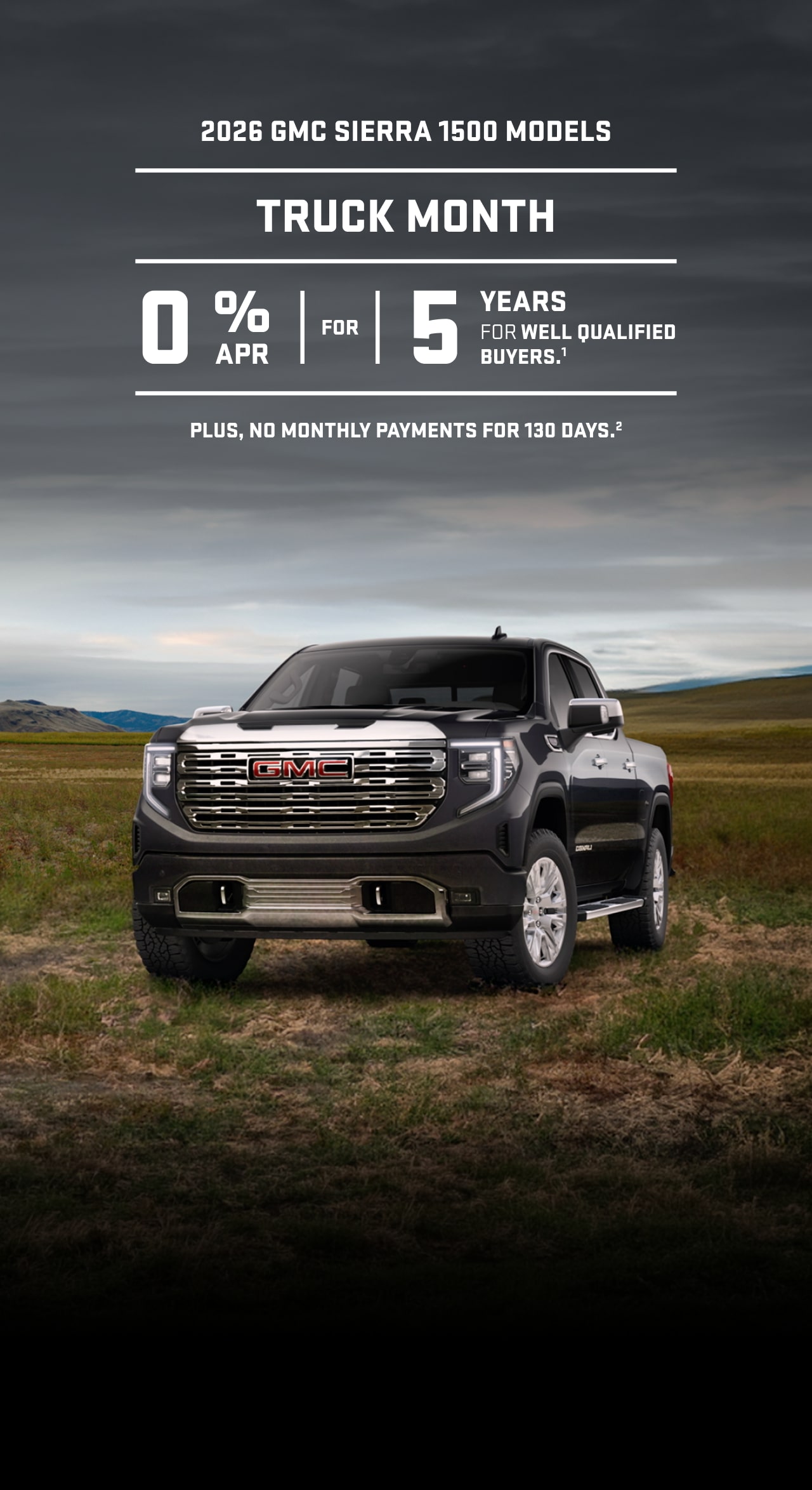 A Light Gray GMC Sierra HD Denali Pickup Truck Parked on a Dirt Road with Mountains in the Background