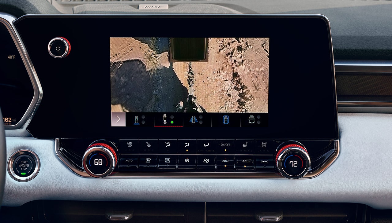 Vertical GMC Infotainment Screen Displaying Hitch Guidance with an Overhead View of the Truck and a Close-Up of the Hitch