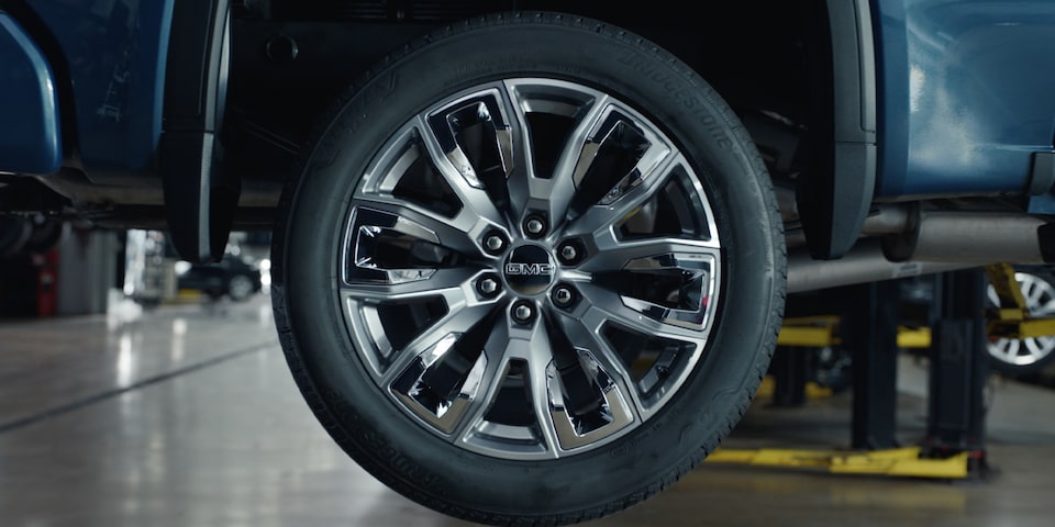 A Close-up View of a Tire on a Vehicle in a Service Garage.