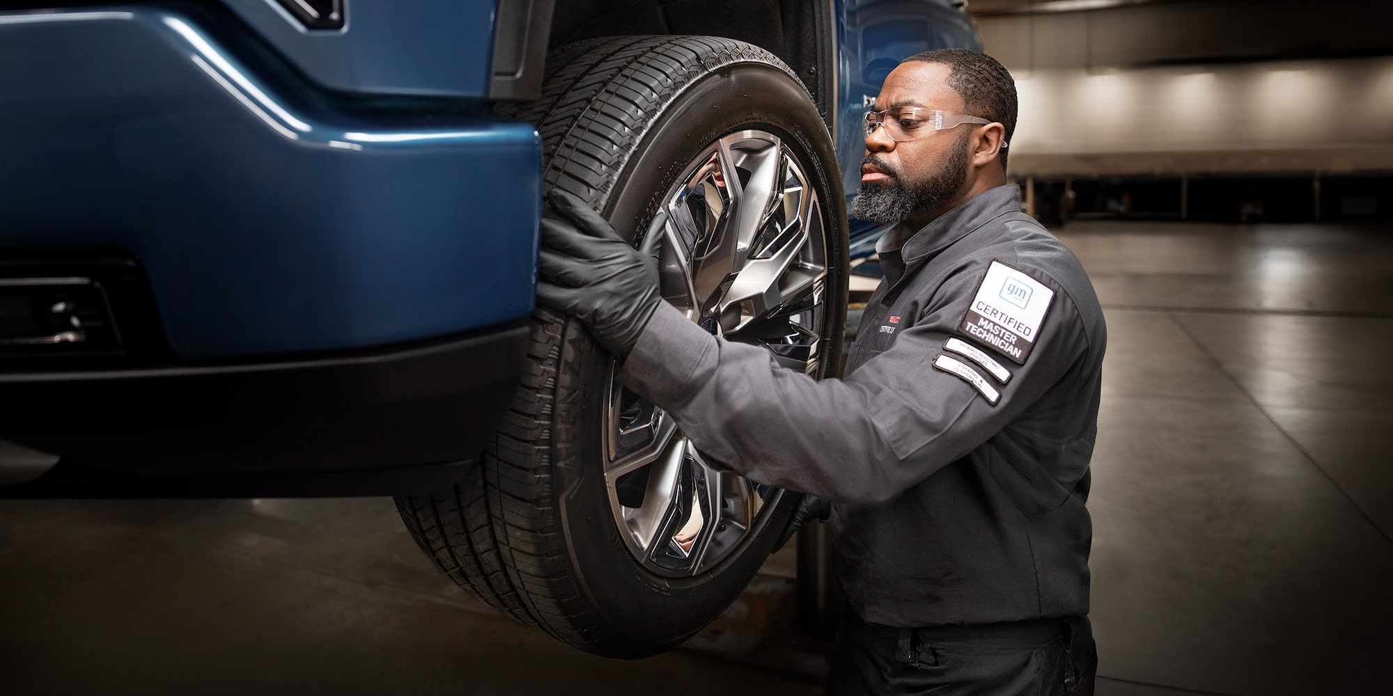 GMC Certified Service technician changing a tire