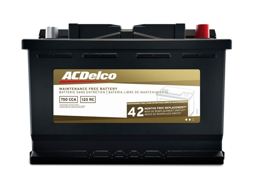 GMC Certified Service Technician Installing New Wheel on a Vehicle