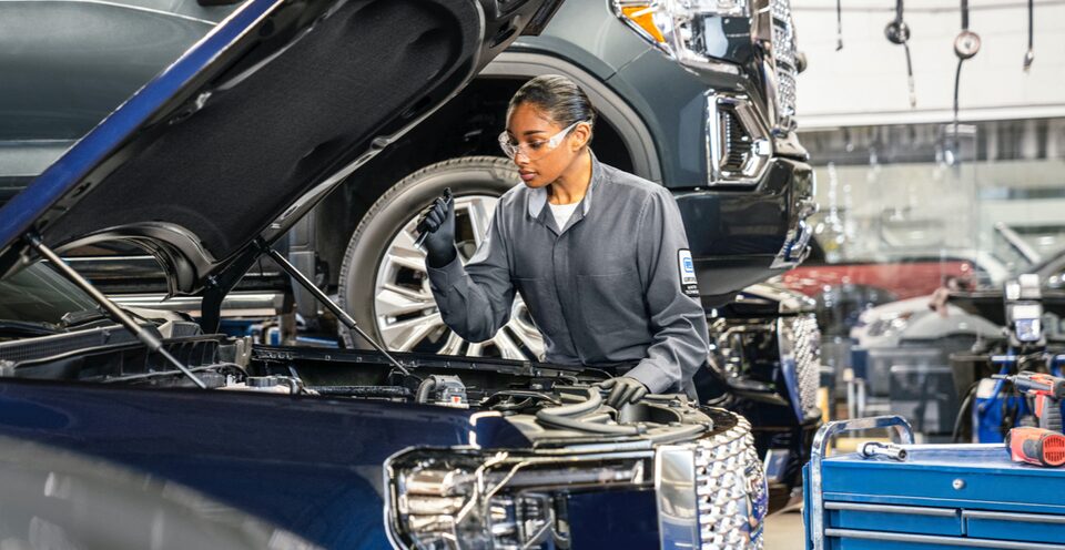 GMC Certified Service technician inspects a vehicle