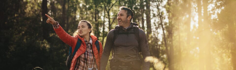 Couple Hiking in Nature with their GMC Rewards