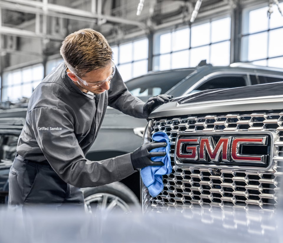 Employee cleaning car