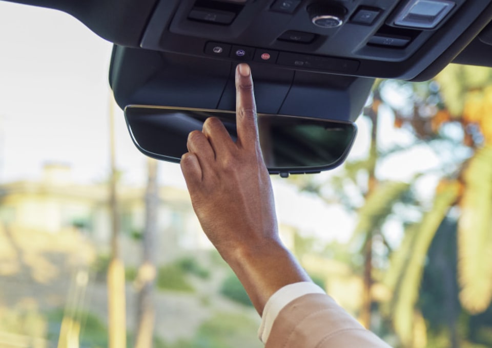 My GMC Rewards member pressing OnStar services button