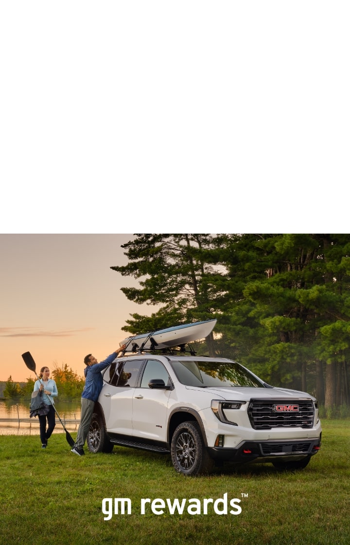 two people with kayak and car