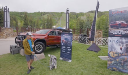 Man walking his dog at the GoPro Mountain Games