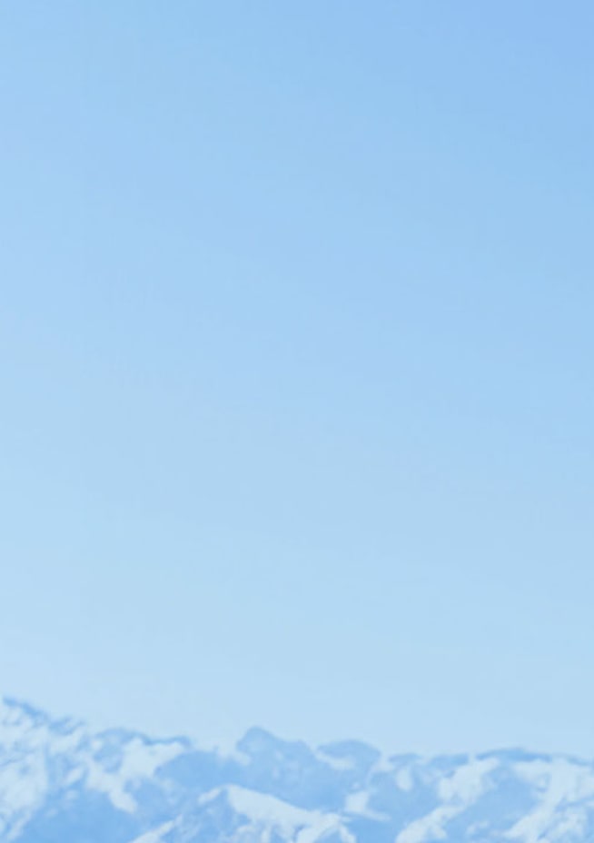 Credit card on a light blue, mountain range background.